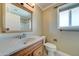 Clean bathroom with wood vanity and updated fixtures at 10252 N 105Th Dr, Sun City, AZ 85351