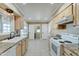 Galley-style kitchen, featuring ample counter space and storage at 10252 N 105Th Dr, Sun City, AZ 85351