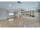 Bright living room featuring hardwood floors and built-in shelving at 10252 N 105Th Dr, Sun City, AZ 85351