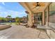 Covered patio with outdoor seating and view of the pool and spa at 10307 E Nopal Ave, Mesa, AZ 85209