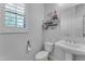 Clean bathroom with single sink vanity and decorative shelving at 10307 E Nopal Ave, Mesa, AZ 85209