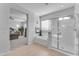 Main bathroom with soaking tub, walk-in shower, and bedroom view at 10307 E Nopal Ave, Mesa, AZ 85209