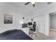 Bedroom featuring a workspace, bed, and built-in shelving at 10307 E Nopal Ave, Mesa, AZ 85209