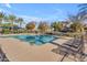 Community pool with lounge chairs and umbrellas at 10307 E Nopal Ave, Mesa, AZ 85209