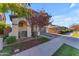 Charming curb appeal with landscaping and a welcoming front entryway at 10307 E Nopal Ave, Mesa, AZ 85209