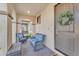 Relaxing front porch with wicker furniture and a welcoming entryway at 10307 E Nopal Ave, Mesa, AZ 85209