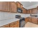 Bright kitchen with white countertops and dark wood cabinets at 10307 E Nopal Ave, Mesa, AZ 85209