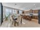 Bright kitchen with dining area, lots of natural light, and wood cabinets at 10307 E Nopal Ave, Mesa, AZ 85209