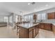 Open concept kitchen with island and views into adjacent dining area at 10307 E Nopal Ave, Mesa, AZ 85209