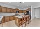 Modern kitchen with wooden cabinets, white countertops, and herringbone backsplash at 10307 E Nopal Ave, Mesa, AZ 85209