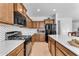 Modern kitchen featuring stainless steel appliances and wood cabinets at 10307 E Nopal Ave, Mesa, AZ 85209