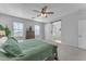 Bright main bedroom with sliding barn door to ensuite bathroom at 10307 E Nopal Ave, Mesa, AZ 85209