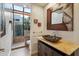 Elegant bathroom with a modern vessel sink and walk-in shower at 10489 N 99Th St, Scottsdale, AZ 85258