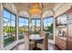 Breakfast nook with water views and custom cabinetry at 10489 N 99Th St, Scottsdale, AZ 85258