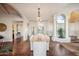 Open dining room with large wooden table and chandelier at 10489 N 99Th St, Scottsdale, AZ 85258