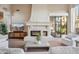 Elegant fireplace in living room with modern TV above the mantle at 10489 N 99Th St, Scottsdale, AZ 85258