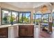 Bright kitchen with granite counters, breakfast nook, and water views at 10489 N 99Th St, Scottsdale, AZ 85258