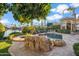 Large pool and spa with a rock water feature at 10489 N 99Th St, Scottsdale, AZ 85258