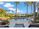 Inviting pool and patio area with water feature, lounge chairs, and stunning water views at 10489 N 99Th St, Scottsdale, AZ 85258