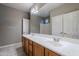 Bathroom with double vanity and large mirror at 1060 W Silver Creek Rd, Gilbert, AZ 85233