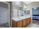 Double vanity bathroom with view of bedroom at 1060 W Silver Creek Rd, Gilbert, AZ 85233