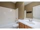 Clean bathroom with single sink vanity and shower/tub combo at 1060 W Silver Creek Rd, Gilbert, AZ 85233