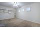 Bedroom with built-in shelving and ceiling fan at 1060 W Silver Creek Rd, Gilbert, AZ 85233