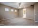 Primary bedroom with ensuite bathroom access and ceiling fan at 1060 W Silver Creek Rd, Gilbert, AZ 85233