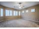 Bright bedroom with ceiling fan and ample natural light at 1060 W Silver Creek Rd, Gilbert, AZ 85233