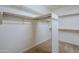 Large walk-in closet with shelving and hanging rods at 1060 W Silver Creek Rd, Gilbert, AZ 85233