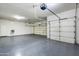 Two-car garage with overhead storage and epoxy flooring at 1060 W Silver Creek Rd, Gilbert, AZ 85233