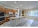 Bright kitchen featuring an island, wood cabinets, and a breakfast nook at 1060 W Silver Creek Rd, Gilbert, AZ 85233