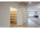 Walk-in pantry with ample shelving for storage at 1060 W Silver Creek Rd, Gilbert, AZ 85233