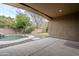 Covered patio area looking towards the pool and backyard at 1060 W Silver Creek Rd, Gilbert, AZ 85233