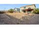 Large backyard with gravel and a covered patio at 11025 W Lane Ave, Glendale, AZ 85307