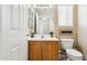 Updated bathroom with wood vanity and neutral decor at 11025 W Lane Ave, Glendale, AZ 85307