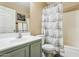 Bathroom with shower/tub combo, updated vanity, and shiplap shower curtain at 11025 W Lane Ave, Glendale, AZ 85307