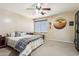 Spacious bedroom with ceiling fan and large window at 11025 W Lane Ave, Glendale, AZ 85307