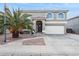 Two-story house with a two-car garage and palm tree landscaping at 11025 W Lane Ave, Glendale, AZ 85307