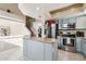 Kitchen with island, stainless steel appliances, and light blue cabinets at 11025 W Lane Ave, Glendale, AZ 85307