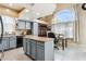 Kitchen with island, stainless steel appliances, and light blue cabinets at 11025 W Lane Ave, Glendale, AZ 85307