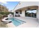 Outdoor entertaining area with pool and built-in grill at 122 E Orange Blossom Path, Queen Creek, AZ 85140