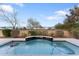 Relaxing pool area with waterfall feature at 122 E Orange Blossom Path, Queen Creek, AZ 85140