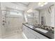 Elegant bathroom with double vanity, large shower and marble tile at 122 E Orange Blossom Path, Queen Creek, AZ 85140