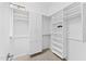 Large walk-in closet with shelving and hanging rods at 122 E Orange Blossom Path, Queen Creek, AZ 85140