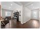 Bright entryway with hardwood floors and built-in shelving at 122 E Orange Blossom Path, Queen Creek, AZ 85140