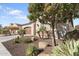 View of home's side elevation, showcasing landscaping and desert plants at 122 E Orange Blossom Path, Queen Creek, AZ 85140