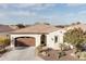 Single-story home with brown garage door at 122 E Orange Blossom Path, Queen Creek, AZ 85140