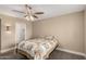 Well-lit bedroom offering a queen bed, ceiling fan and private closet at 12510 W Brandywine Dr, Sun City West, AZ 85375