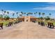 Community building with benches and palm trees at 12510 W Brandywine Dr, Sun City West, AZ 85375